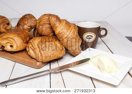 An Buttercake With Raisins And Croissant Is Made Of Puff Pastry