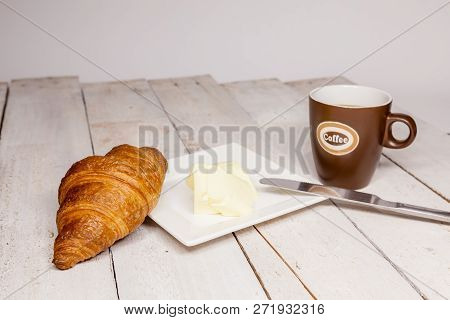 An Buttercake With Raisins And Croissant Is Made Of Puff Pastry
