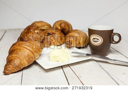 An Buttercake With Raisins And Croissant Is Made Of Puff Pastry