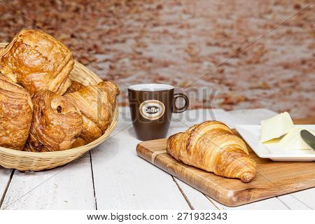 An Buttercake With Raisins And Croissant Is Made Of Puff Pastry