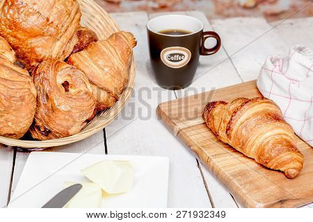 An Buttercake With Raisins And Croissant Is Made Of Puff Pastry