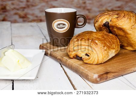 An Buttercake With Raisins And Croissant Is Made Of Puff Pastry