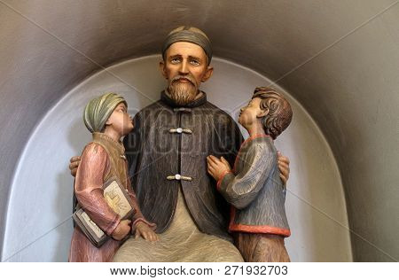LUSON, ITALY - JULY 14, 2018: Josef Freinademetz missionary in China sculpted by Leonhard Delago of Bula in the Saint George church in Luson, Italy