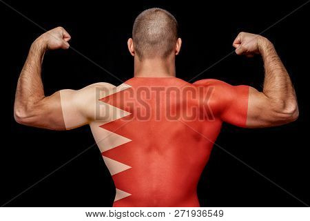 The Back Of A Young Sports Man Wearing A T-shirt With The National Flag Of Bahrain On A Black Isolat
