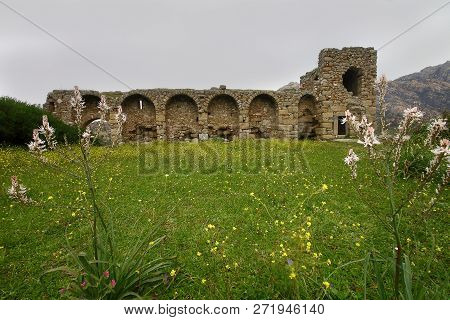 Ruined Walls Of Castle Over The Lake Bafa In A Nature Reserve Situated In Southwestern Turkey