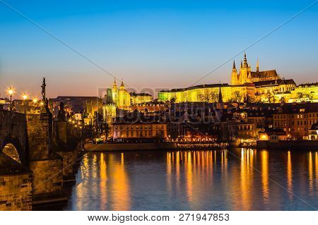 View Of Charles Bridge, Prague Castle And Vltava River In Prague, Czech Republic During Sunset Time.