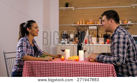 Happy Loving Couple Is Having Romantic Dinner At Home.