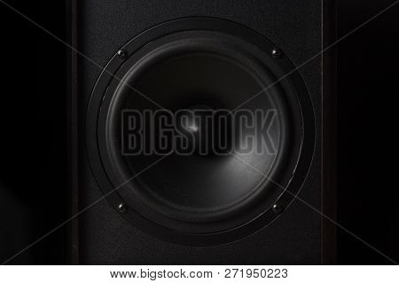 Black Music Speaker On A Black Isolated Background. Party Or Music Listening Concept.