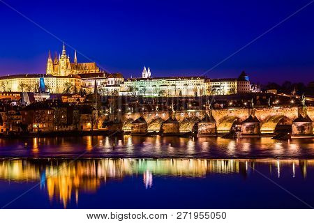 View Of Charles Bridge, Prague Castle And Vltava River In Prague, Czech Republic During Sunset Time.