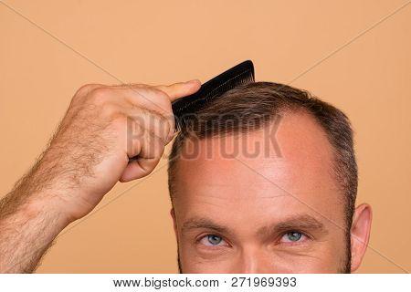 Close-up Cropped View Portrait Of Nice Attractive Handsome Cheerful Brunet Guy Combing Dark Grey Hai