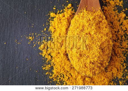 Turmeric Powder (curcuma), Also Known As Indian Saffron. Top View With Copy Space
