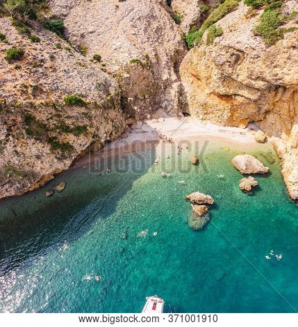The bird's eye view on bay in the rocky coastline of the Adriatic sea. The island Cres, Croatia. Adriatic.  September 2019