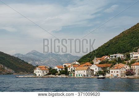 The Coastline Of The City Of Lepetane In Montenegro, Near The Ferry Crossing Through Kotor Bay.