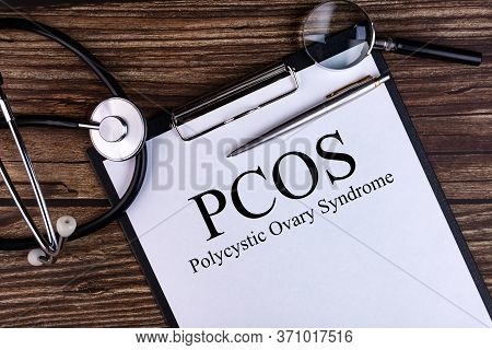 Pcos Text Is Written On A Tablet Lying On A Dark Table With A Stethoscope And A Magnifying Glass. Me