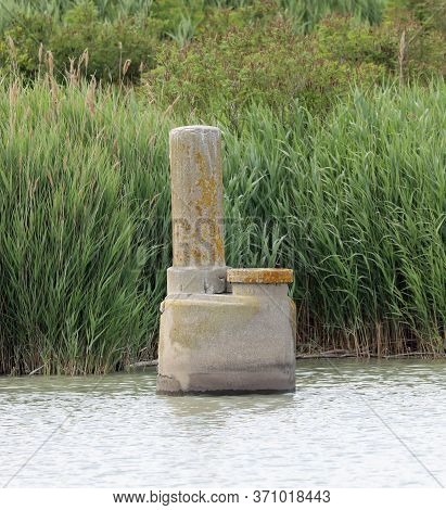 Large Abandoned Well For The Extraction Of Methane Gas From The Depths Of The Lagoon