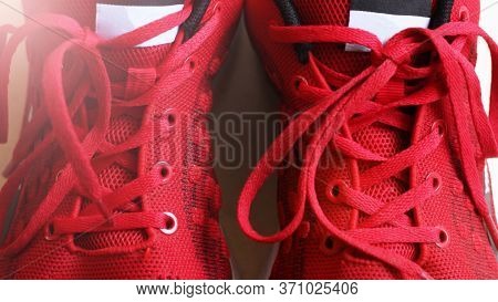 Fashion Shoes With Shoestring. Red Sneaker And Shoelace So Close.