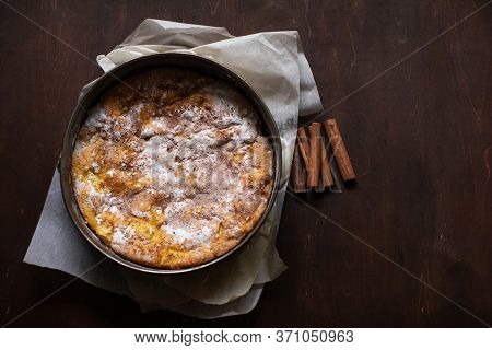 Homemade Apple Pie On A Wooden Table In The Kitchen