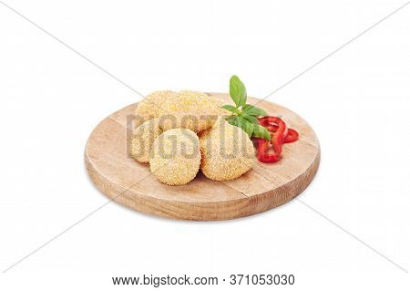 Raw Crispy Chicken Nuggets Breaded In Bread Crumbs On A Wooden Board With Basil And Chili Pepper. Re
