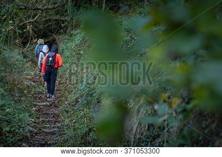 Ripafratta, Italy - January 06, 2020:  Unknown People During Trekking In The Medieval Village Of Rip
