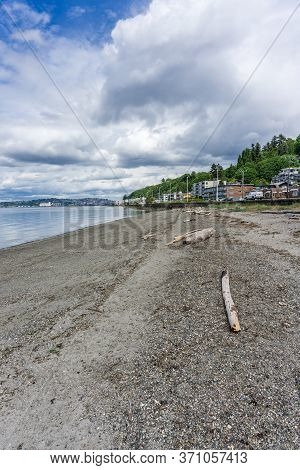 Clouds Hover Over Alki Beach In West Seattle, Washington.
