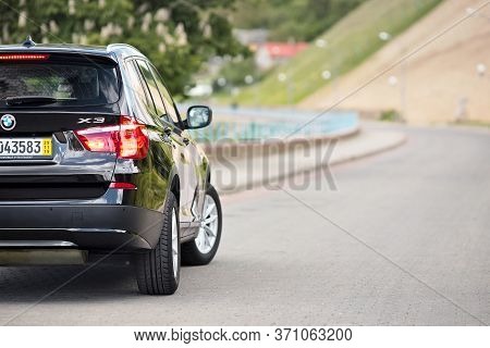 Grodno, Belarus - June 2020: Bmw X3 Ii F25 2.0i Xdrive Rear Outdoors On Sunny Road Background Of Sum
