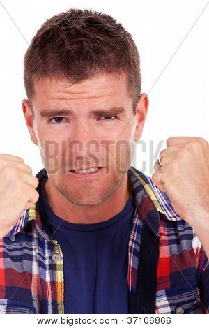 casual young woman making the thumbs up ok sign in front of a group of young people smiling