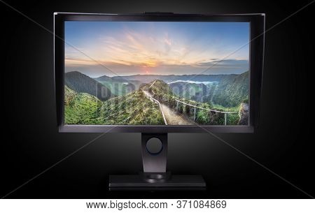 Professional Photographer Monitor With Shading Hood Isolated On Black