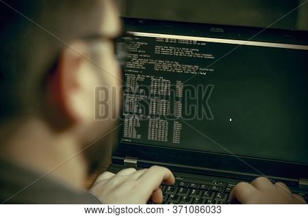 Criminal Hacker Penetrating Network System From His Dark Hacker Room. Computer Program Writer At Wor