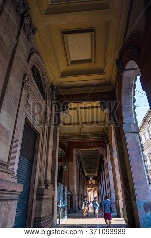 Genoa, Italy - August 18, 2019: Tourists Walking Under Arches Of Via Xx Setembre, The Main Boulevard