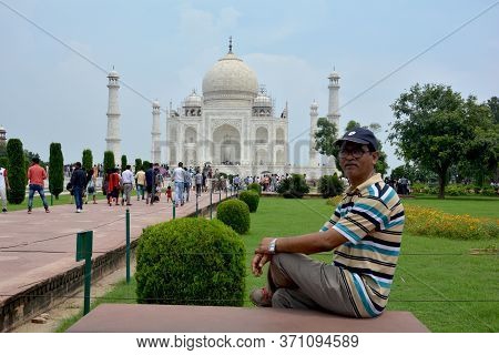 Agra, Uttar Pradesh, India, 9th August, 2018:   Indian Tourist Posing For Photograph Before The Famo