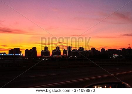 Saint Petersburg, Russia-june 2019: Sunset In The Reflections Of City Windows, Traffic Moving Along 