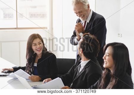 Marketing Team Consulting Sales Plan With Supervisor Senior Manager In Conference Room Before Presen