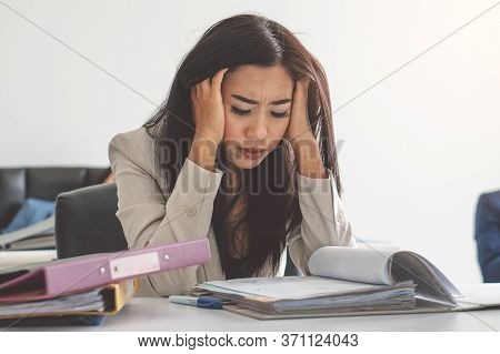 Asian Business Woman Have Migraine Headache In The Workplace. Stressed Female Employee Running Out O