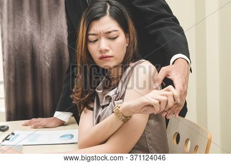 Sexsual Harassment In Workplace. Unhappy Female Employee Protecting Her Self From Hand Of Boss Touch