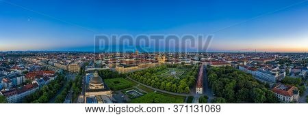 Aerial, Morning View Over The Bavarian Capital Munich, Germany With Houses, Offices And A Green Park