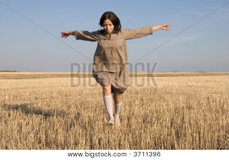 Girl Running On The Field