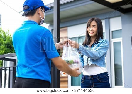 Asian Delivery Man Delivering Food, Fruit, Joice And Vegetable To Customer Home - Online Grocery Sho