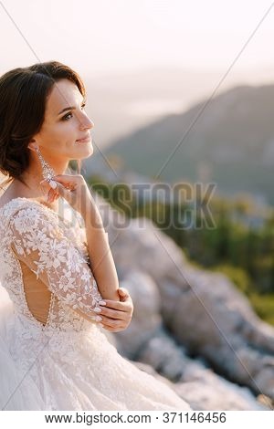 Fine-art Destination Wedding Photo In Montenegro, Mount Lovchen. The Bride On Top Of The Mountain Pl