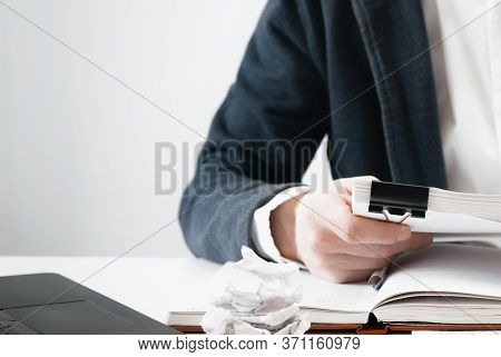 Cropped View Of Businessman Works With Financial Papers At The Table. Finance Concept