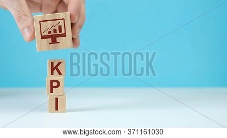 Wooden Blocks With The Word Kpi - Key Performance Indicator.