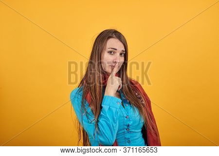 Index Finger On Lips, Silence Gesture, Shhh Quiet, Asks For Voicelessness Forefinger At The Mouth. Y