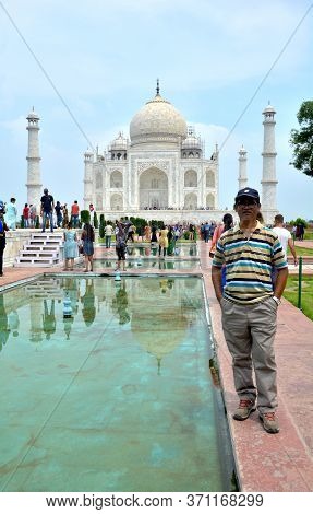 Agra, Uttar Pradesh, India, 9th August, 2018:   Indian Tourist Posing For Photograph Before The Famo