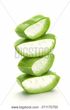 Stack Of Cut Aloe Vera Leaves On White Background. Aloe Vera Gel Inside Leaves Benefits For Healthy 
