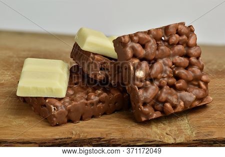 Nutrition, Diet And Junk Food. Chocolate Crispies Sweets And White Chocolate Set One Next To The Oth