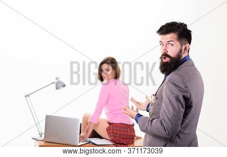 She Makes Him Crazy. Man Boss Enter Office Of Sexy Girl Working Laptop. Office Manager Or Secretary.