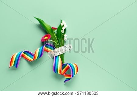 Thank You Doctors And Nurses Rainbow Ribbon In Hand Of Mature Woman With Chamomile Flower And Grass 