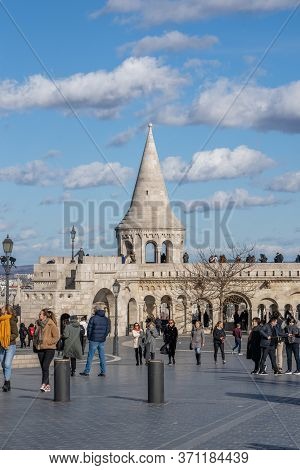 Budapest, Hungary - Feb 11, 2020: Cumulostratus Clouds Over Fishermans Bastion With Tourists In Sunn