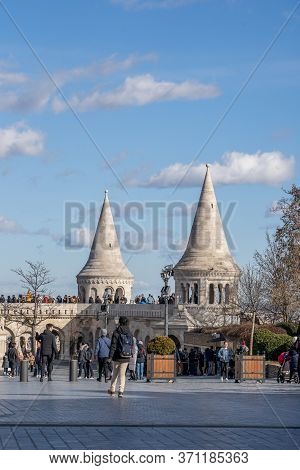 Budapest, Hungary - Feb 11, 2020: Cumulostratus Clouds Over Fishermans Bastion With Tourists In Sunn