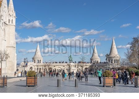 Budapest, Hungary - Feb 11, 2020: Cumulostratus Clouds Over Fishermans Bastion With Tourists In Sunn
