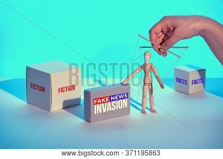 Box With Text Fake News Invastion . Infodemics Of Fake News And Rumors About Covid-19. Sinister Hand